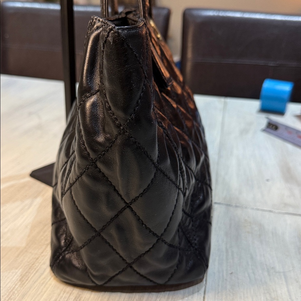 CHANEL Black Quilted Handbag with Gold Accent - Picture 4 of 13
